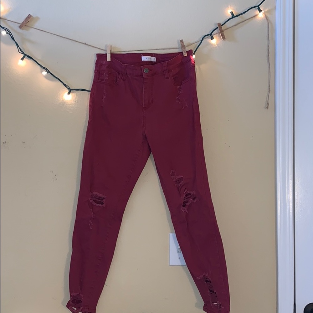 Ripped burgundy jeans